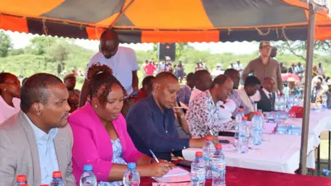 Kenya's parliamentary defence committee at one of the outdoor hearings