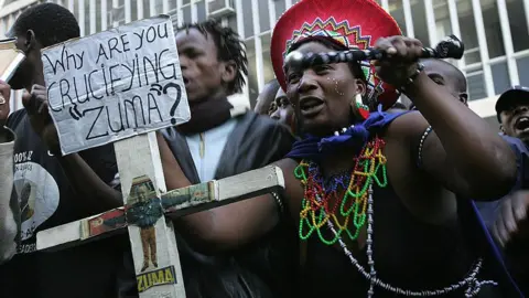 AFP Supporters, as well as opponents, of Mr Zuma protested outside the court where he was being tried for rape