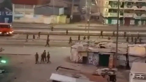 Reddit A still from a video showing securityforces