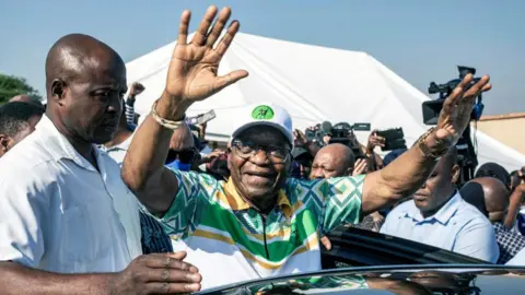 Getty Images Former President Jacob Zuma greets supporters after voting at Ntolwane Primary School voting station on May 29, 2024