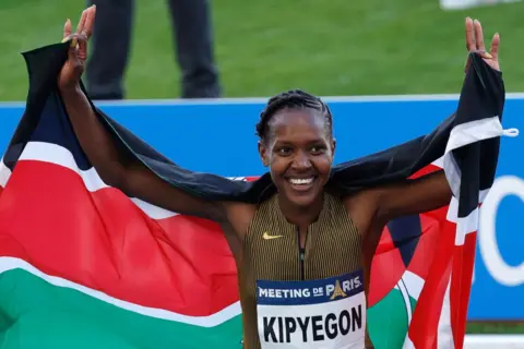 GEOFFROY VAN DER HASSELT/AFP Kenya's Faith Kipyegon reacts after winning and beating the world record in the women's 1500m during the 