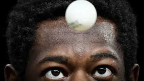 Jung Yeon-Je / AFP An image of Senegalese table tennis player Ibrahima Diaw during the Paris Olympics singles match on on 29 July 2024.