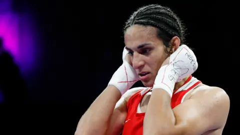 Reuters Imane Khelife wearing a boxing vest stares forward