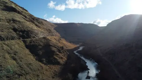 A river running through a valley