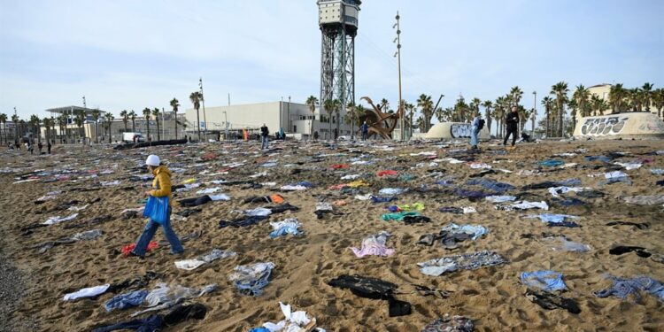 A display by Spanish NGO Proactiva Open Arms at the San Sebastian Beach in Barcelona in December 2023, to draw attention to migrants dying at sea as they try to reach Europe. ( Josep LAGO / AFP)