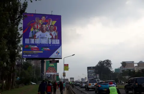 A StarTimes advertisement billboard by a highway in Nairobi featuring the tagline 