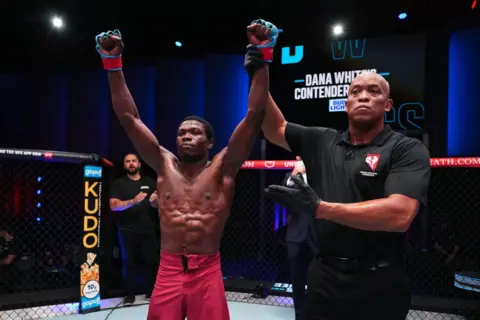 CHRIS UNGER / GETTY IMAGES Josias Musasa of The Democratic Republic of Congo reacts after a split-decision victory against Otari Tanzilovi of Georgia in a bantamweight fight during Dana White's Contender series in Las Vegas, Nevada.