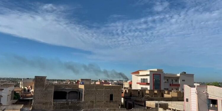 Smoke rising from an area near the Bamako airport after shots and detonations were heard. (AFPTV / AFP)