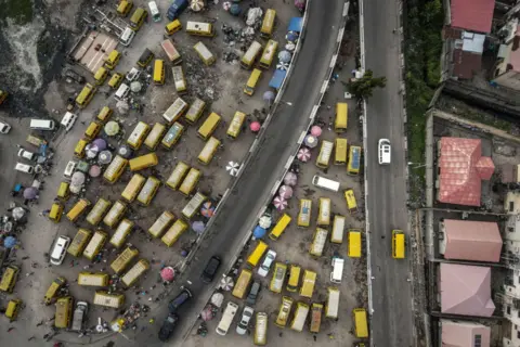 Olympia de Maismont / AFP This aerial photograph shows the Obalende bus terminus in Lagos on September 24, 2024.