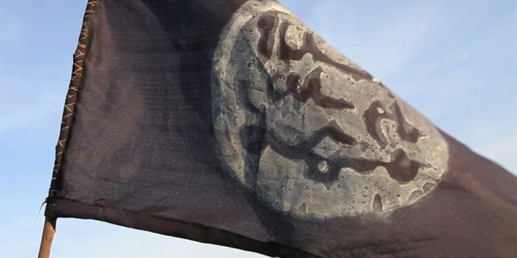 A Boko Haram flag flutters from an abandoned command post. (Stephane Yas/AFP)