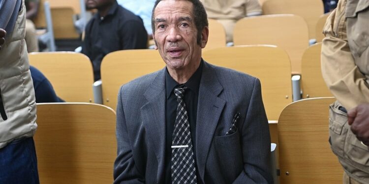 Former Botswana president Ian Khama (C) sits in the Broadhurst Magistrate court in Gaborone on 13 September 2024. (Monirul Bhuiyan/AFP)