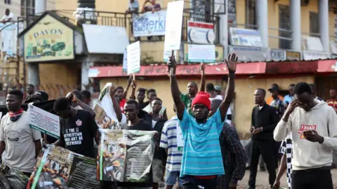 AFP Protesters carry placards during the 