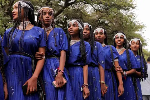 TIKSA NEGERI / REUTERS Women dressed in traditional Oromo costumes attend the Irreecha celebration, the Oromo people's thanksgiving festival at Hora Arsadi.