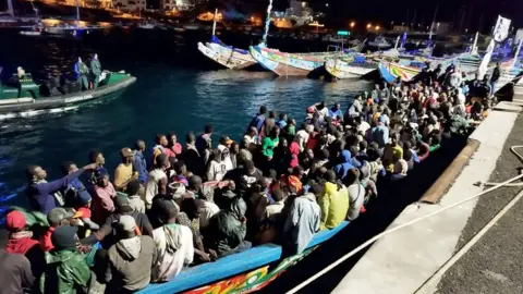 Migrants arriving by night on boats in El Hierro in the Canary Islands