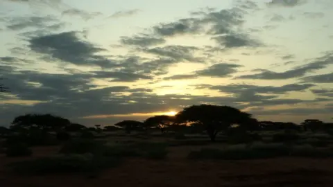 Mohamed Gabobe Sun setting in the desert