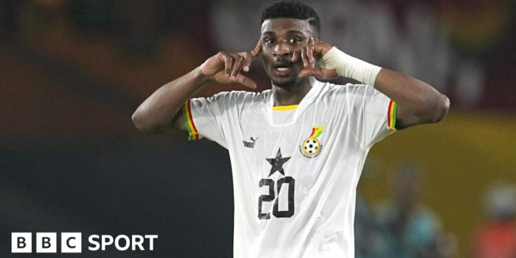 Mohammed Kudus points to his head during a match for Ghana's Black Stars