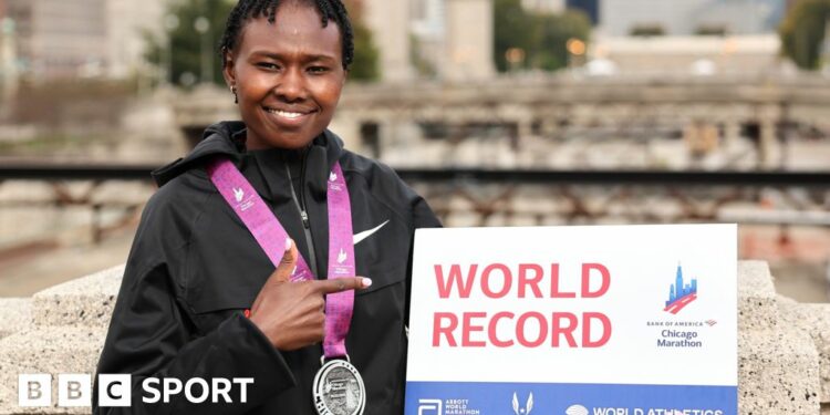 Ruth Chepngetich slumps in the finish area of the Chicago Marathon