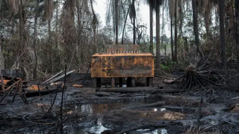 Getty Images An illegal oil refinery destroyed by members of the Nigerian Navy forces is pictured on April 19, 2017 in the Niger Delta region near the city of Port Harcourt