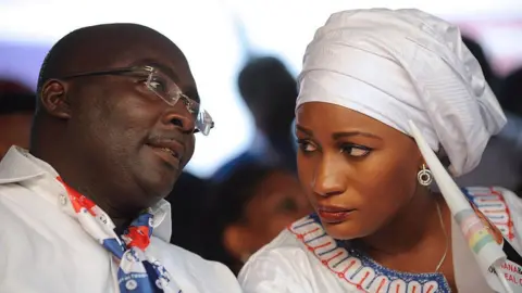 AFP Mahamudu Bawumia talks with his wife Samira during a campaign rally