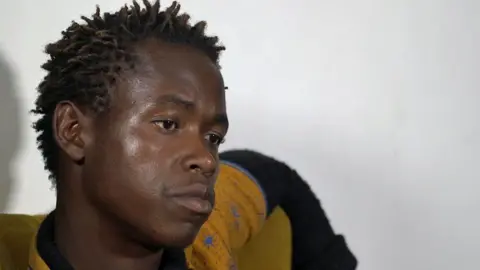 Kennedy Gondwe / BBC Mayamiko Mwape pictured during his interview with the BBC, with his hair in twists and looking serious