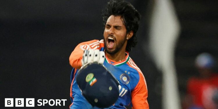 India batter Tilak Varma roars in celebration after hitting a century in a T20 against South Africa