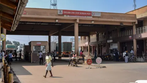 AFP A general view of the Kenyan side of the Malaba border post. A security booth can be seen under an arch, which has a banner that says 