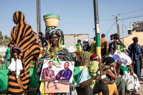 AFP Supporters celebrate as opposition leader Ousmane Sonko and Presidential candidate for the Diomaye President coalition Bassirou Diomaye Faye attend campaign event in Cap Skirring, Senegal on on March 16, 2024