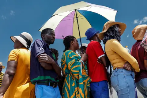 AFP Voters queue at a polling station at the Sam Nujoma stadium in Windhoek on November 27, 2024 during Namibia's general election