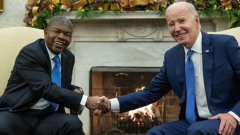 Getty Images US President Joe Biden shakes hands with Angolan President Joao Lourenco during a meeting in the Oval Office of the White House in Washington, DC, on 30 November 2023