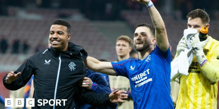 Rangers' Hamza Igamane (L) and Nicolas Raskin celebrate at full time during a UEFA Europa League 2024/25 League Phase MD5 match between OGC Nice and Rangers at the Stade de Nice