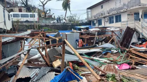 Getty Images This photograph shows a pile of debris of metal sheets and wood after the cyclone Chido hit France's Indian Ocean territory of Mayotte, on December 14, 2024 in the capital Mamoudzou