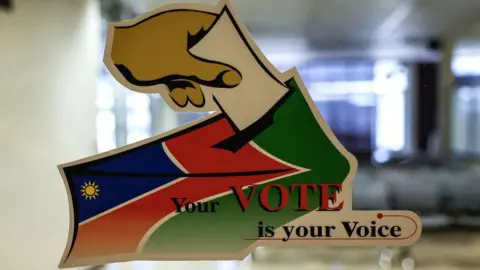 AFP This photograph shows the logo of the Electoral Commission of Namibia (ECN), following the country's general election, in Windhoek on November 28, 2024