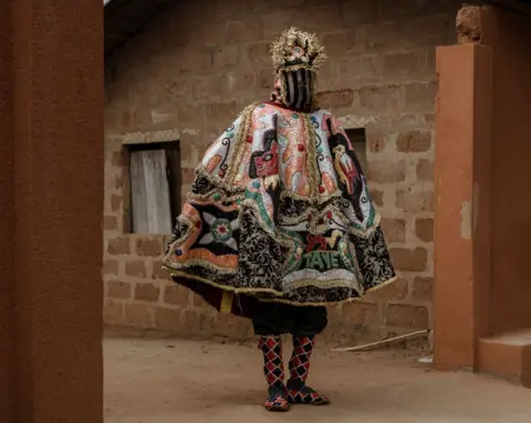 Marco Longari / AFP A person wearing a richly textured outfit for the at the annual Voodoo festival in Benin, Ouidah represents the visible manifestation of the spirit of departed ancestors - Thursday 9 January 2025.