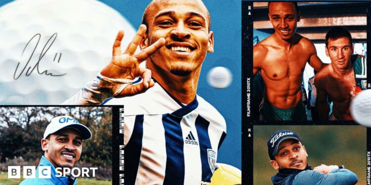 Peter Odemwingie (left) and Peter Crouch (right) laugh as they sit in a dugout in red Stoke City training tops, with red seats visible in the background