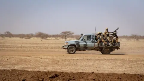 AFP Burkina Faso soldiers aboard a pick-up truck in 2020